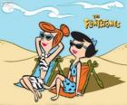 Wilma Flintstone and Betty Rubble sunbathing on the beach