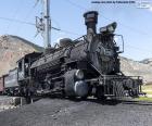 Old steam locomotive with the wagon of coal