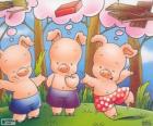 The three little pigs, thinking about how to build its three houses to hide from the big bad wolf