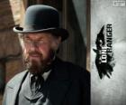 Latham Cole (Tom Wilkinson) in the film The Lone Ranger