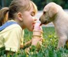 Girl and dog sharing an ice cream