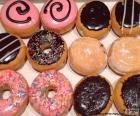 Donuts with several flavors, some of them stuffed 