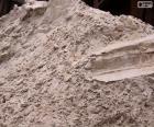 The sand used in construction as a component for concrete and cement