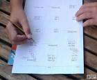 Child doing homework, multiplications, divisions, you subtractions and additions