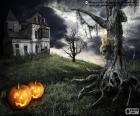 A scary haunted house with an old tree and two pumpkins