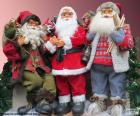 Three Santa Claus dolls