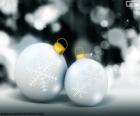 Two White Christmas balls decorated with the symbol of the ice or snow