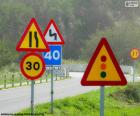 Several traffic signs on a road