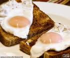 Two toasts with fried eggs for breakfast