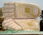 Feet of a large reclining Buddha with several symbols in the soles of the feet. Myanmar