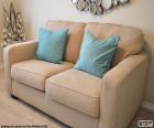 Two seater sofa beige in colour with two additional pillows