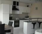 A open-plan kitchen is a stay that includes the kitchen, the dining room and the room in the same area