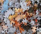 A jigsaw puzzle is a board game where the goal is to form an image by placing the pieces correctly