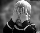 Child covering his eyes