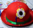 Red bowler hat with a flower