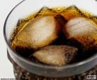 Glass of cola with ice drink for hot days