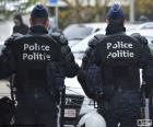 Two riot police during a break, seen from behind