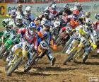 First corner in a Motocross race, where all drivers are grouped
