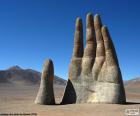 The Hand of the desert is a sculpture located in the Atacama desert to 75 km south of the city of Antofagasta, Chile. It is the work of the Chilean sculptor Mario Irarrázabal (1992)