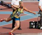 Athlete performing the shot-put. It is a test that is to throw the weight at the maximum possible distance
