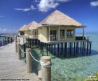 Set of wooden cottages over the Pacific Ocean