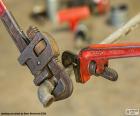 Pipe wrench of different size by loosening a pipe elbow