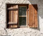 Window square with shutters of wood of style rustic