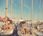 Three sailboats moored in a Marina