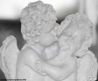 Two angels of love, two Cupids kiss on the cheek
