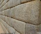 Detail of a wall with perfectly placed stones, example of the architecture of the period of the incas