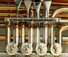 Detail of the four rotary valves of a tuba, the largest musical instrument in the brass family