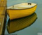 Yellow boat moored at the dock