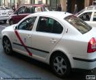 Taxi from Madrid, are white, with a red band at the door and a sign of "TAXI"