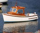 Small fishing boat of wood in the port