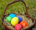 Basket with six Easter eggs, each painted a different color