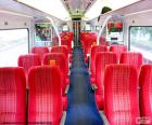 Interior of a wagon with red seats and the blue ground