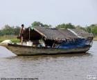 The sampan is a Chinese wooden boat with the flat bottom, used in China and Southeast Asia