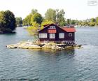 A house situated on a small island in Mille-Isles, Quebec, Canada