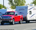 Red pickup truck with caravan