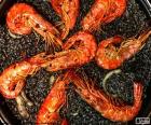 A delicious black paella. Rice is colored with squid ink