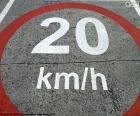 Sign painted on the asphalt, area limited to 20 km/h to improve coexistence between pedestrians and vehicles