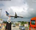 A plane landing at Princess Juliana International Airport on the island of Saint Martin in the Caribbean