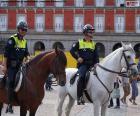 Two officers of the squadron of Cavalry of the Municipal police of Madrid