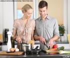 A couple in the kitchen of his home preparing a delicious recipe