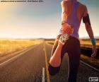 An athlete doing some stretching of the legs before running