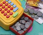 A colorful cash register toy with banknotes and coins