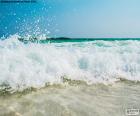 The waves reaching the beach