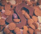 A letter S of chocolate surrounded by cookies
