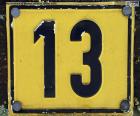 Yellow plate with the number thirteen in black