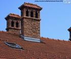 Two brick chimneys on the roof of a House